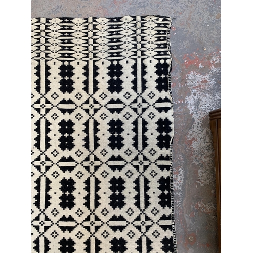 949 - A vintage black and white handmade woollen blanket