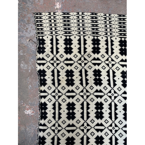 949 - A vintage black and white handmade woollen blanket