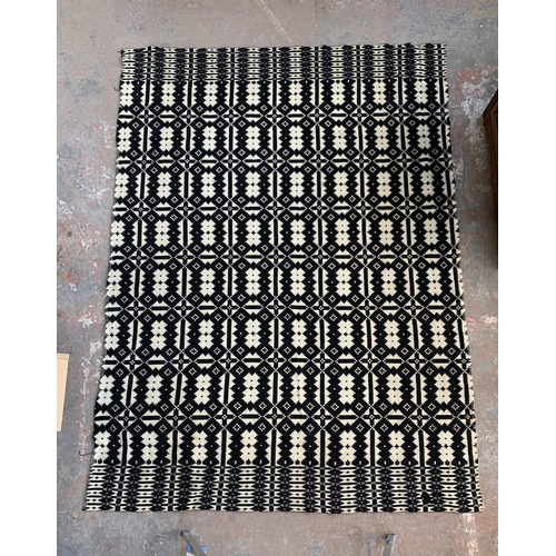 949 - A vintage black and white handmade woollen blanket