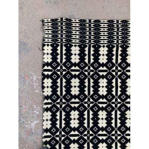 949 - A vintage black and white handmade woollen blanket