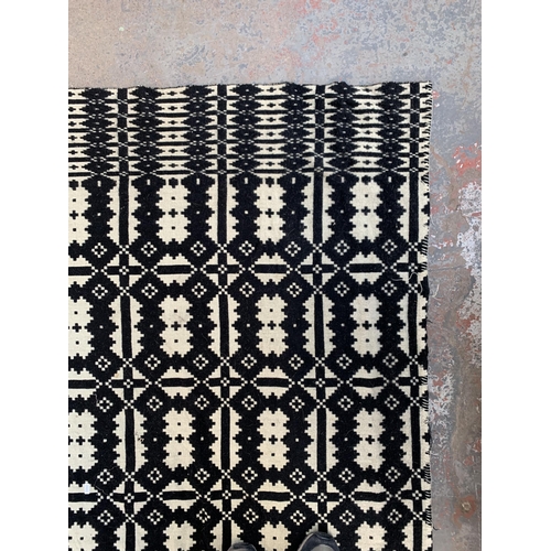 949 - A vintage black and white handmade woollen blanket