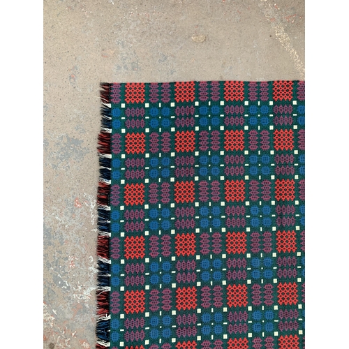 950 - A mid 20th century double sided Welsh blanket - approx. 220cm x 170cm