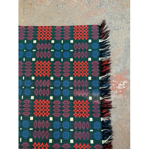 950 - A mid 20th century double sided Welsh blanket - approx. 220cm x 170cm