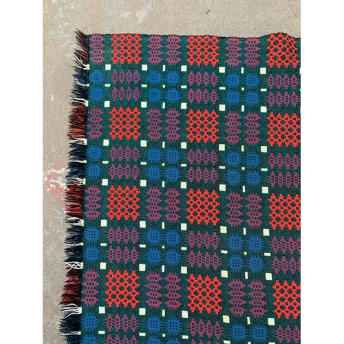 950 - A mid 20th century double sided Welsh blanket - approx. 220cm x 170cm