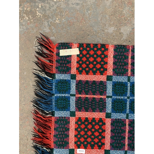 950 - A mid 20th century double sided Welsh blanket - approx. 220cm x 170cm