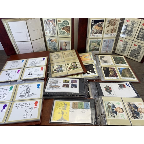 986 - Seven albums containing a large collection of Royal Mail Post Office postcards and first day covers