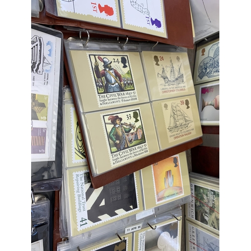 986 - Seven albums containing a large collection of Royal Mail Post Office postcards and first day covers