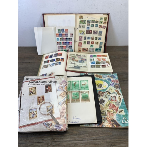 996 - Seven albums containing a collection of antique and later worldwide stamps