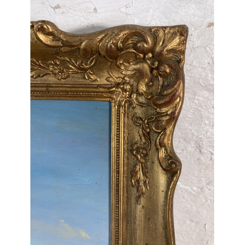 256 - A gilt framed R. Marshall oil on board - approx. 60cm high x 75cm wide