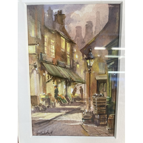 264 - A gilt framed watercolour of a street scene signed lower left - approx. 36cm high x 30cm wide