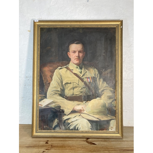 269 - An early 20th century gilt framed oil on canvas portrait of a military officer signed upper right - ...