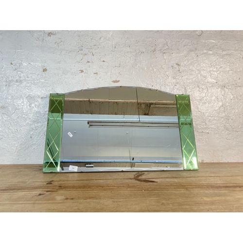 290 - An Art Deco style frameless bevelled edge wall hanging mirror with green tinted glass - approx. 46cm... 