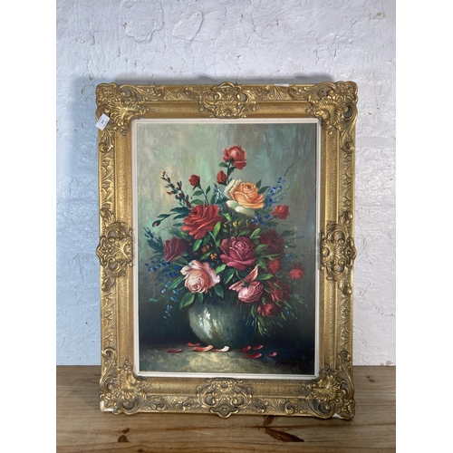 293 - A gilt framed floral still life oil on canvas signed A. Debeuf - approx. 88cm high x 67cm wide