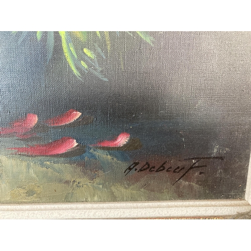 293 - A gilt framed floral still life oil on canvas signed A. Debeuf - approx. 88cm high x 67cm wide