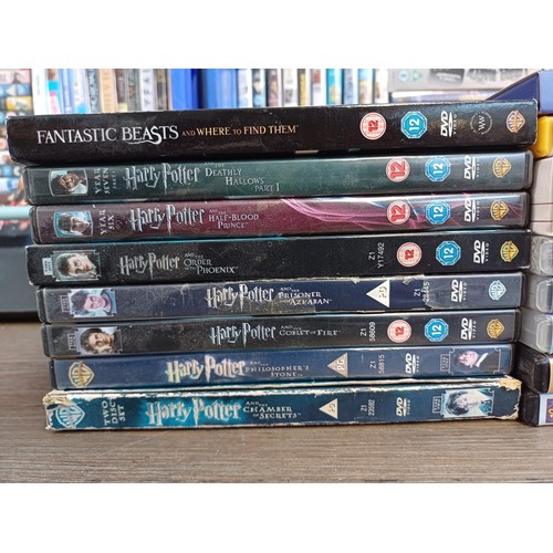 367 - Three boxes containing a large collection of DVDs to include eight Harry Potter, Coco, the Sting, So... 