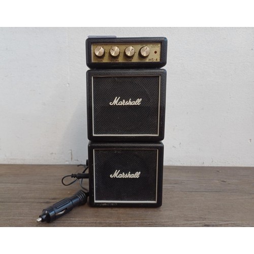 368 - A Marshall MS-4 micro guitar practice amplifier with car lighter power cable