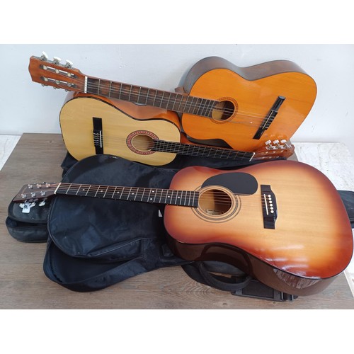 369 - Three cased guitars, one right-handed Encore steel-strung dreadnought strung left-handed, one Eleca ... 