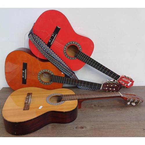 371 - Three child's nylon strung classical guitars, two Martin smith and one Jose Ferrer