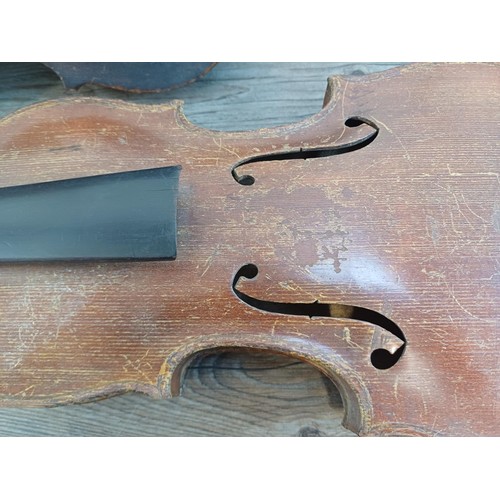 376 - Two unlabelled violins, one possibly baroque with tuning pegs and tailpiece (at fault - break at hee... 