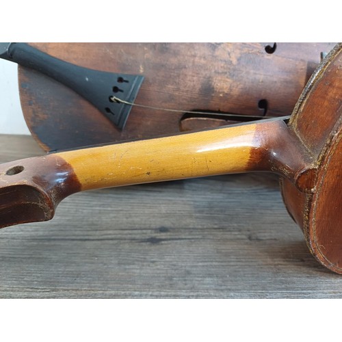 376 - Two unlabelled violins, one possibly baroque with tuning pegs and tailpiece (at fault - break at hee... 