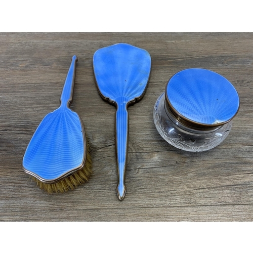 937 - An Art Deco blue enamel three piece dressing table set