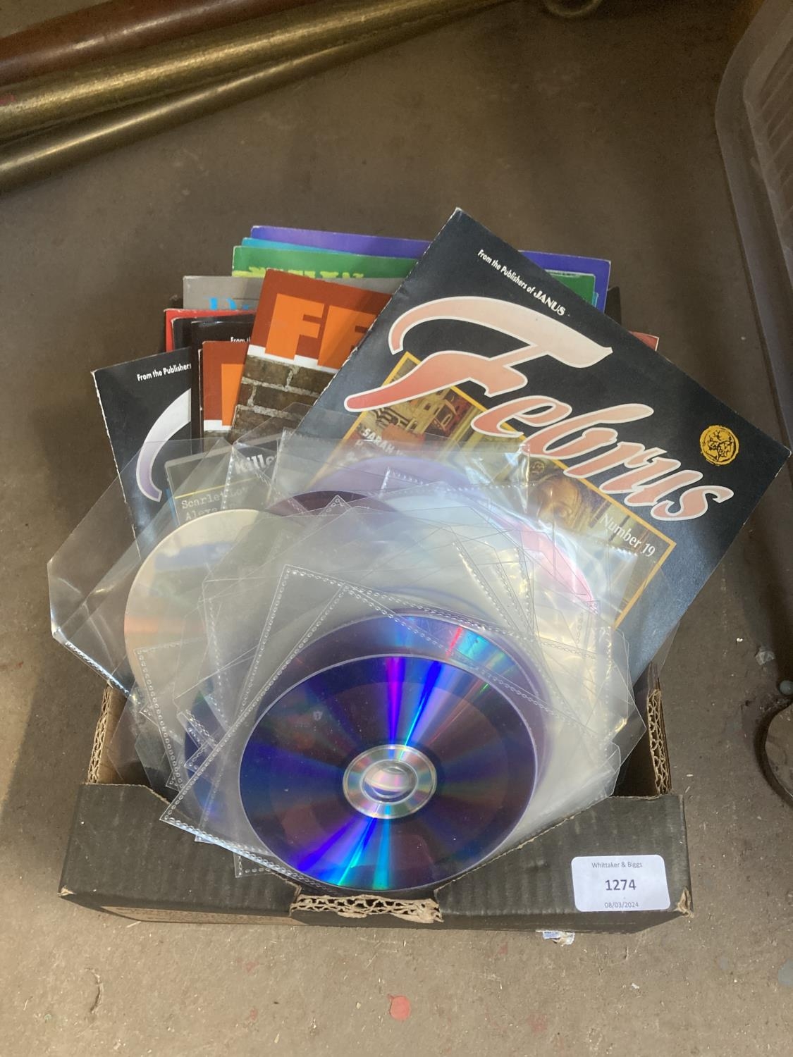 A box containing pornographic DVDs and magazines to include Februs etc.