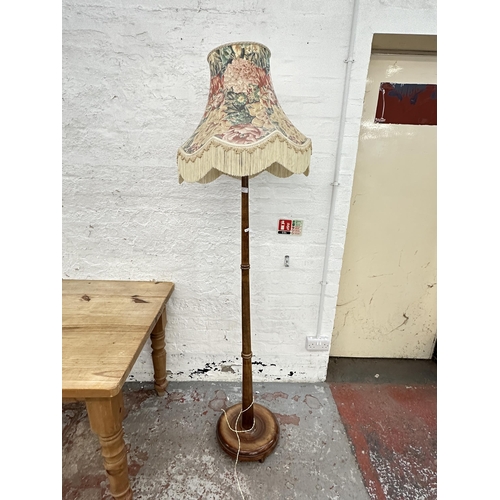 144A - A 1930s stained beech standard lamp - approx. 190cm high including shade