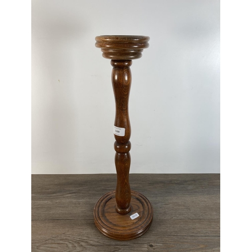 1100 - A vintage oak floor standing ashtray with nautical brass top - approx. 49cm high