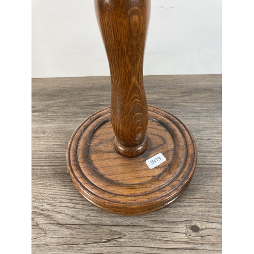 1100 - A vintage oak floor standing ashtray with nautical brass top - approx. 49cm high