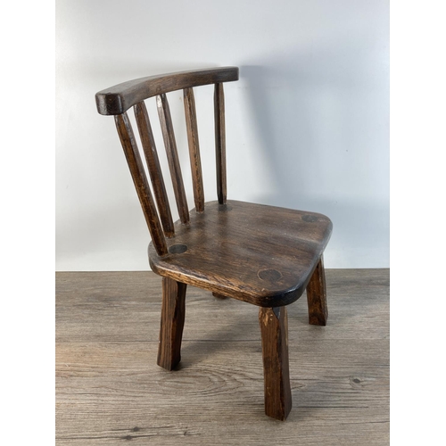 1101 - A vintage oak stick back doll's chair - approx. 41cm high x 23cm wide