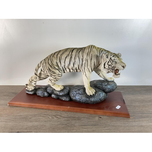 1103 - A resin white tiger figurine - approx. 30cm high x 55cm long