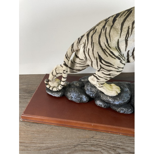 1103 - A resin white tiger figurine - approx. 30cm high x 55cm long