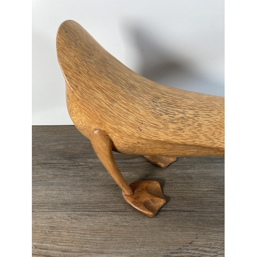 1105 - A contemporary carved wooden duck figurine - approx. 25cm high x 44cm long