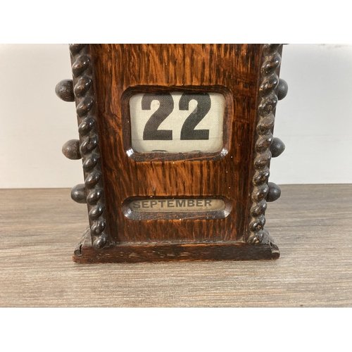 1114 - An early/mid 20th century oak perpetual desk calendar - approx. 16cm high x 11cm wide