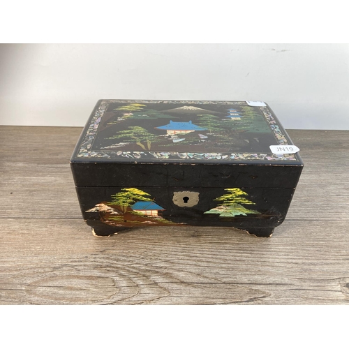 1115 - A early/mid 20th century Japan lacquer and hand painted musical jewellery box