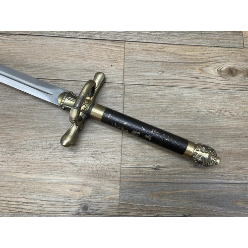 1126 - An ornamental brass and steel sword with leatherette scabbard - approx. 102cm long