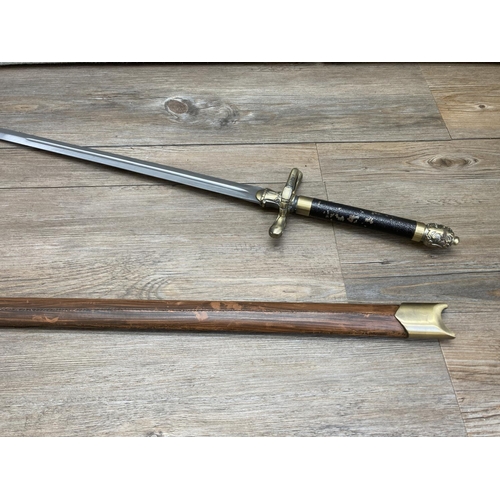 1126 - An ornamental brass and steel sword with leatherette scabbard - approx. 102cm long