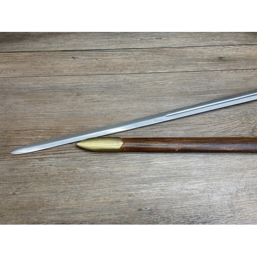 1126 - An ornamental brass and steel sword with leatherette scabbard - approx. 102cm long