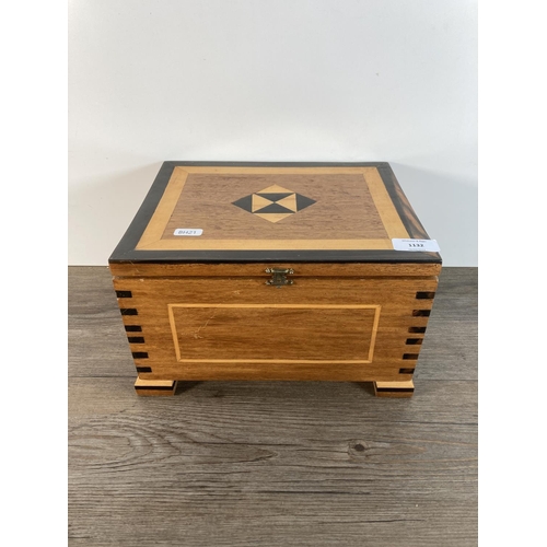 1132 - A mid to late 20th century marquetry inlaid hardwood jewellery box - approx. 16cm high x 27.5cm wide... 