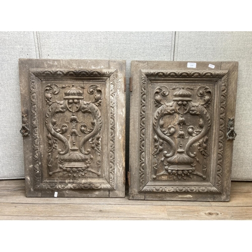 1143 - A pair of 19th century carved oak door panels - approx. 66cm high x 47cm wide