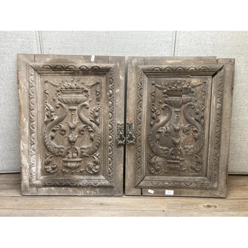 1143 - A pair of 19th century carved oak door panels - approx. 66cm high x 47cm wide