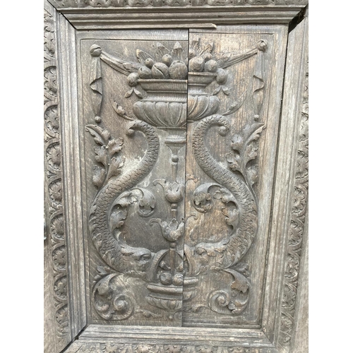 1143 - A pair of 19th century carved oak door panels - approx. 66cm high x 47cm wide