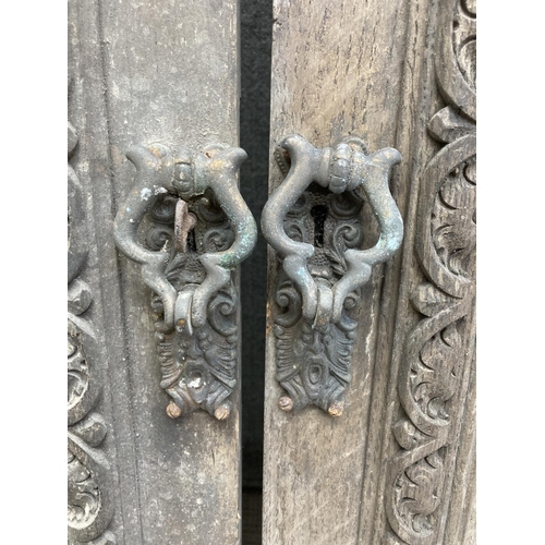 1143 - A pair of 19th century carved oak door panels - approx. 66cm high x 47cm wide