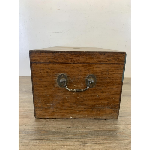 1045 - A 19th century oak rectangular storage box with brass handles - approx. 25cm high x 56cm wide x 32cm... 