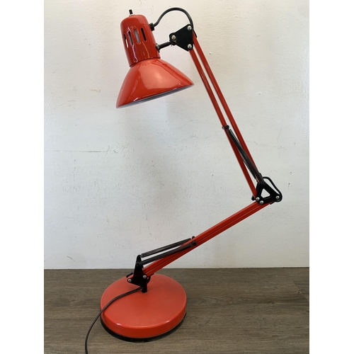 1047 - A late 20th century red metal angled desk lamp