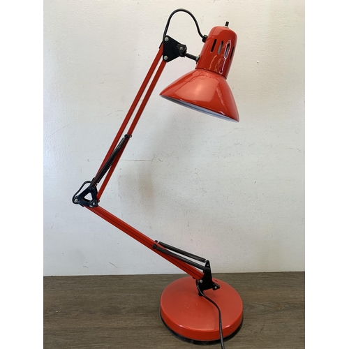 1047 - A late 20th century red metal angled desk lamp