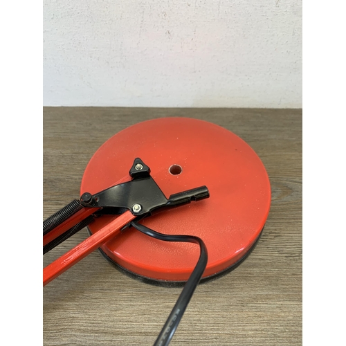 1047 - A late 20th century red metal angled desk lamp