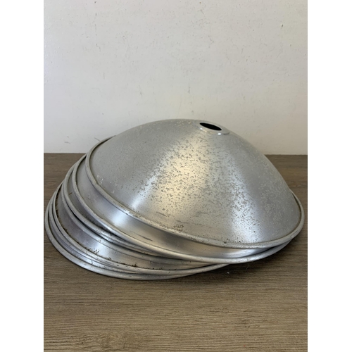 1049 - Seven mid 20th century style brushed aluminium and white painted flying saucer shaped ceiling light ... 