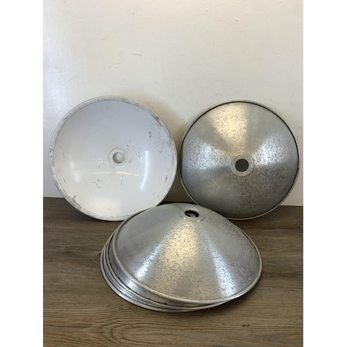 1049 - Seven mid 20th century style brushed aluminium and white painted flying saucer shaped ceiling light ... 