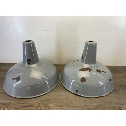 1050 - A pair of mid 20th century grey and white enamel factory ceiling light shades - approx. 45.5cm in di... 